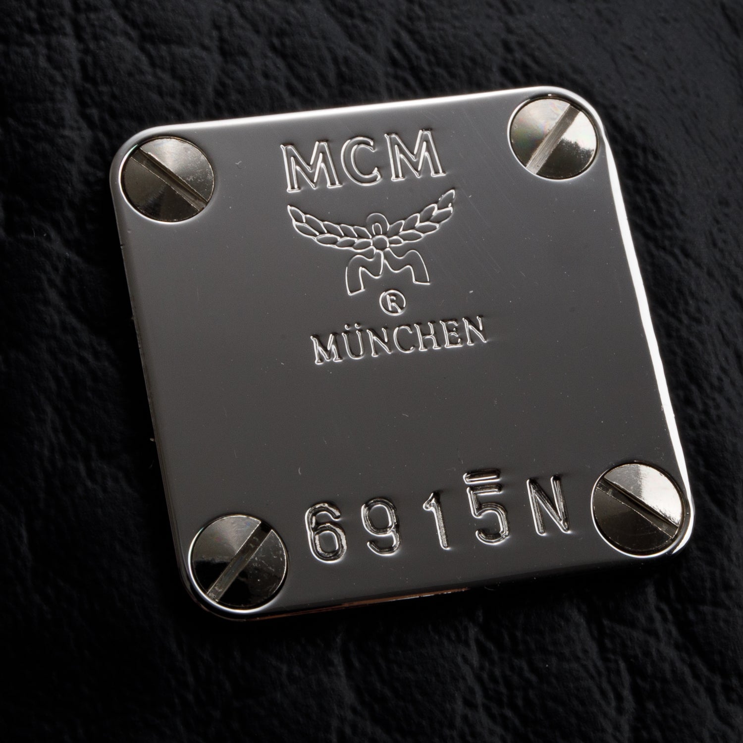 MCM Black Visetos Coated Canvas Mini Essential Top Handle Bag