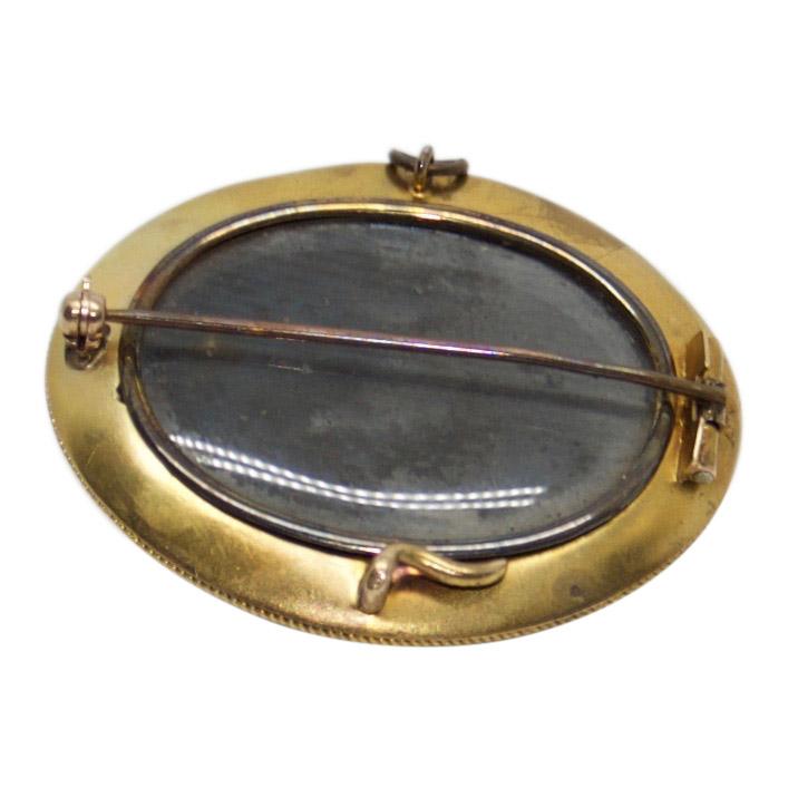 Antique Oval Brooch with Black Enamel and Cabochon Onyx