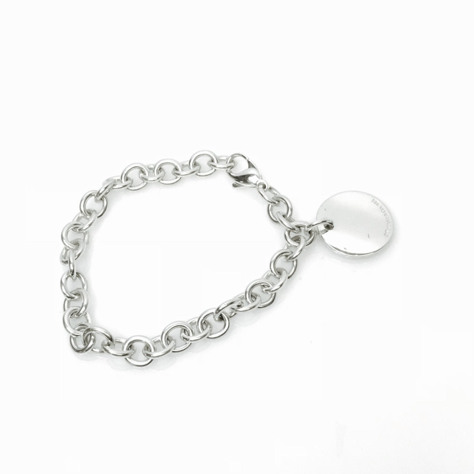 Tiffany & Co. Notes Round Tag Charm Bracelet in Sterling Silver