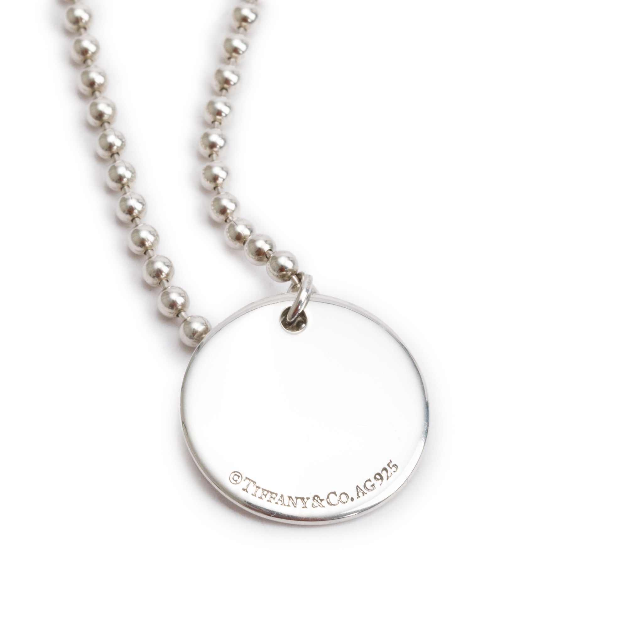 Tiffany & Co. Sterling Silver Alphabet Letter 'L' Medium Round Tag Pendant Necklace
