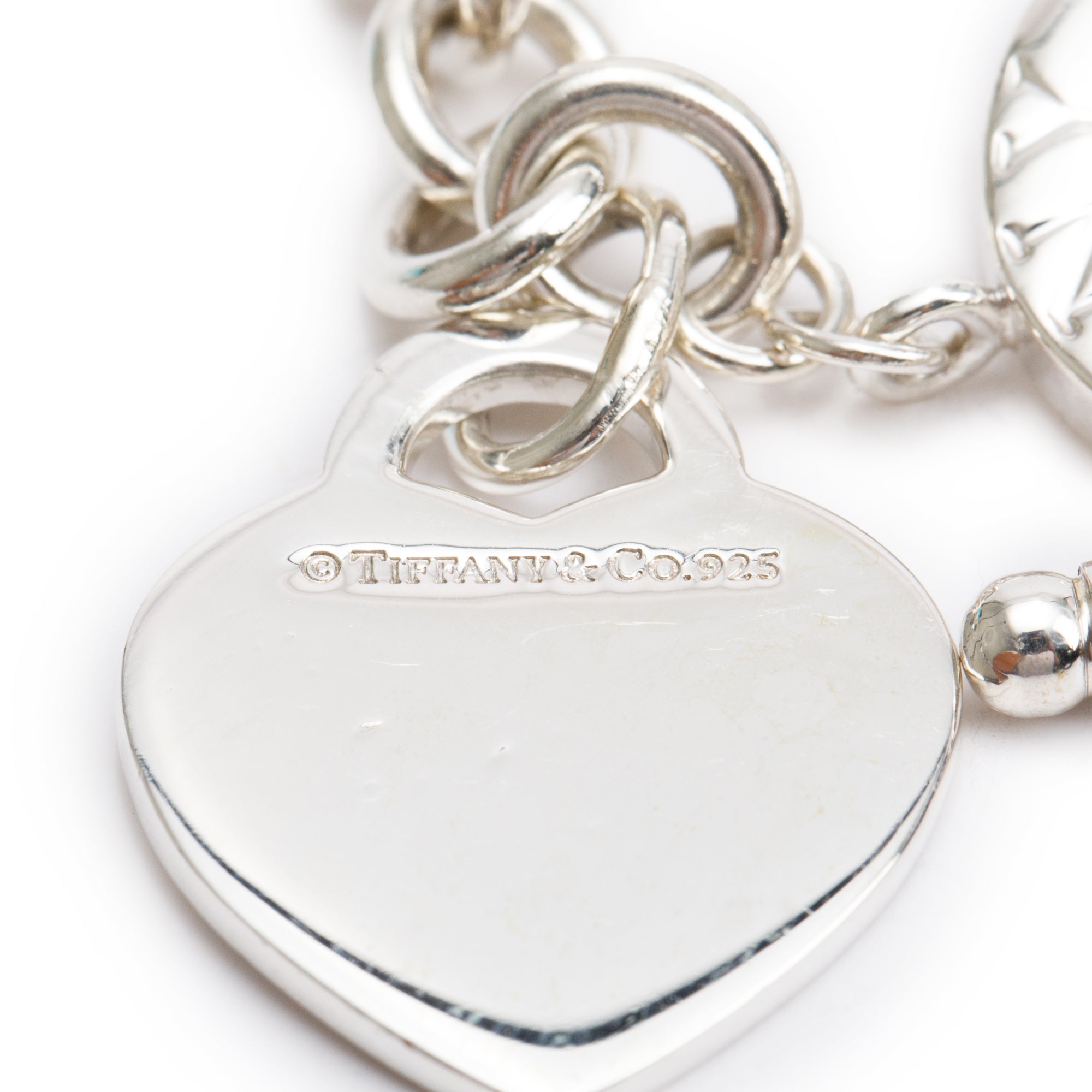 Tiffany & Co. Sterling Silver Notes 'I Love You' Heart Tag Charm Bracelet with Toggle Clasp