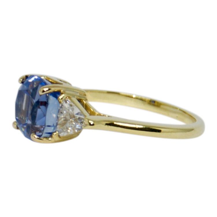 Blue Sapphire and Diamond Three Stone Ring