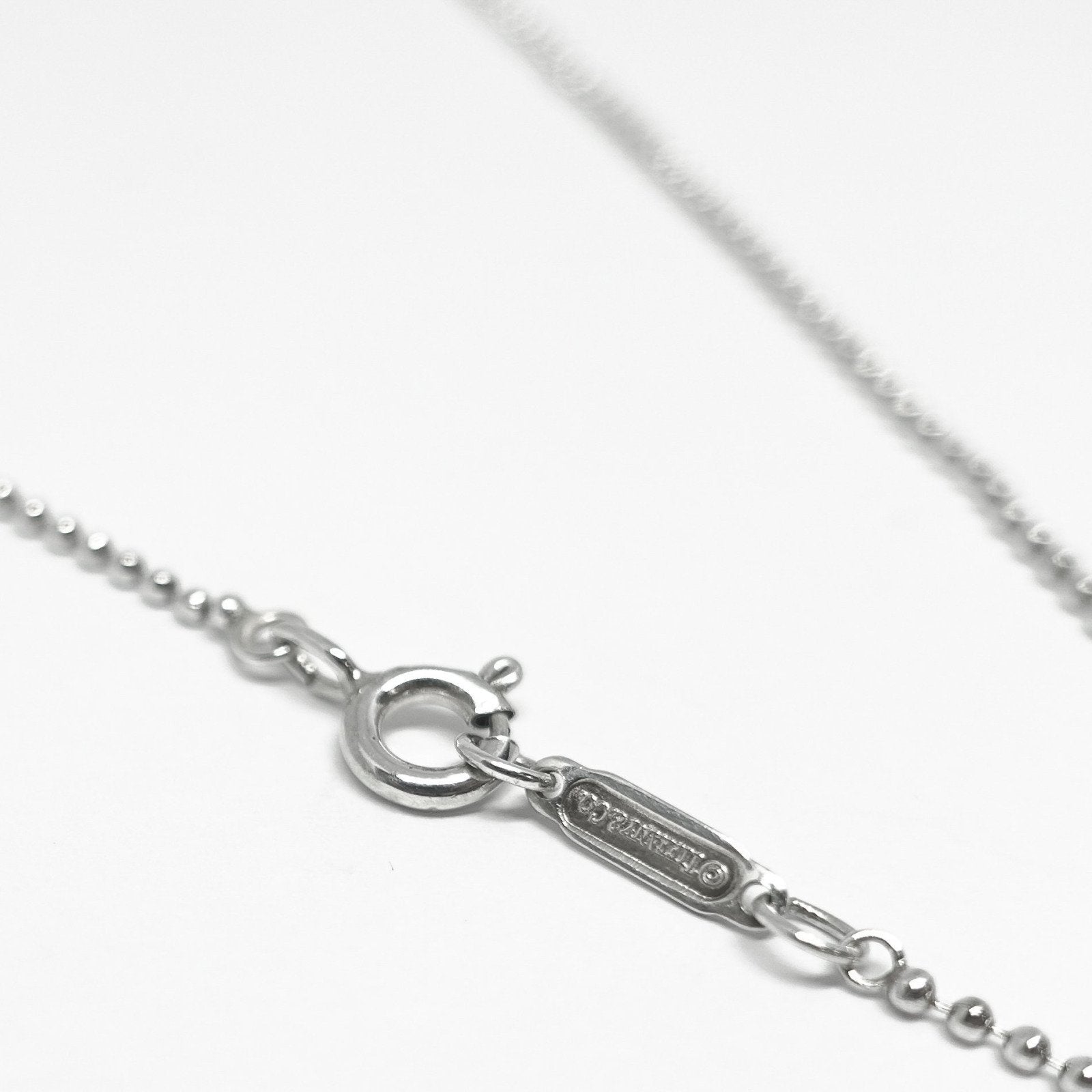 Tiffany & Co. Notes Letter 'L' Disc Charm Pendant Necklace