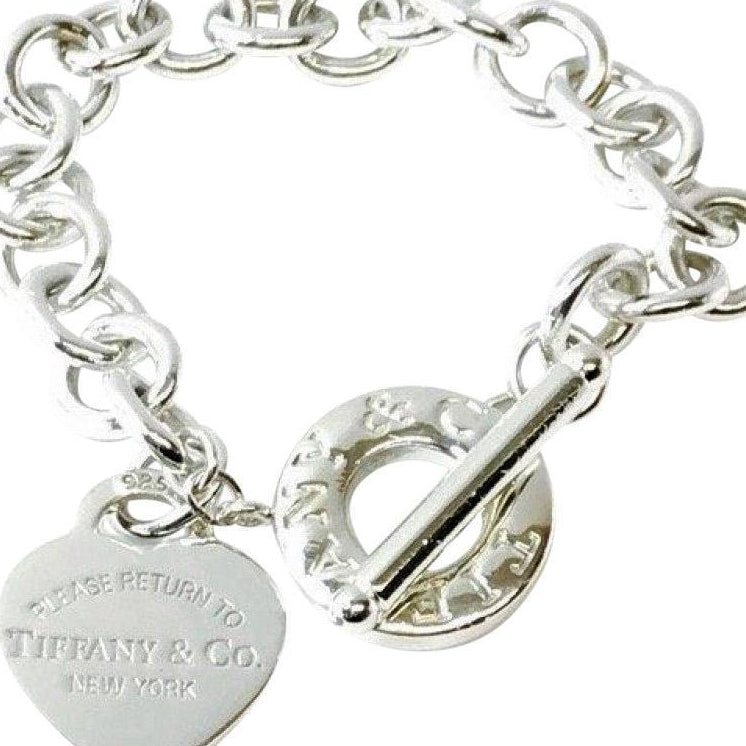 Tiffany & Co. Sterling Silver Charm Bracelet Shopping Bag Charm Lobster  Clasp – St. John's Institute (Hua Ming)