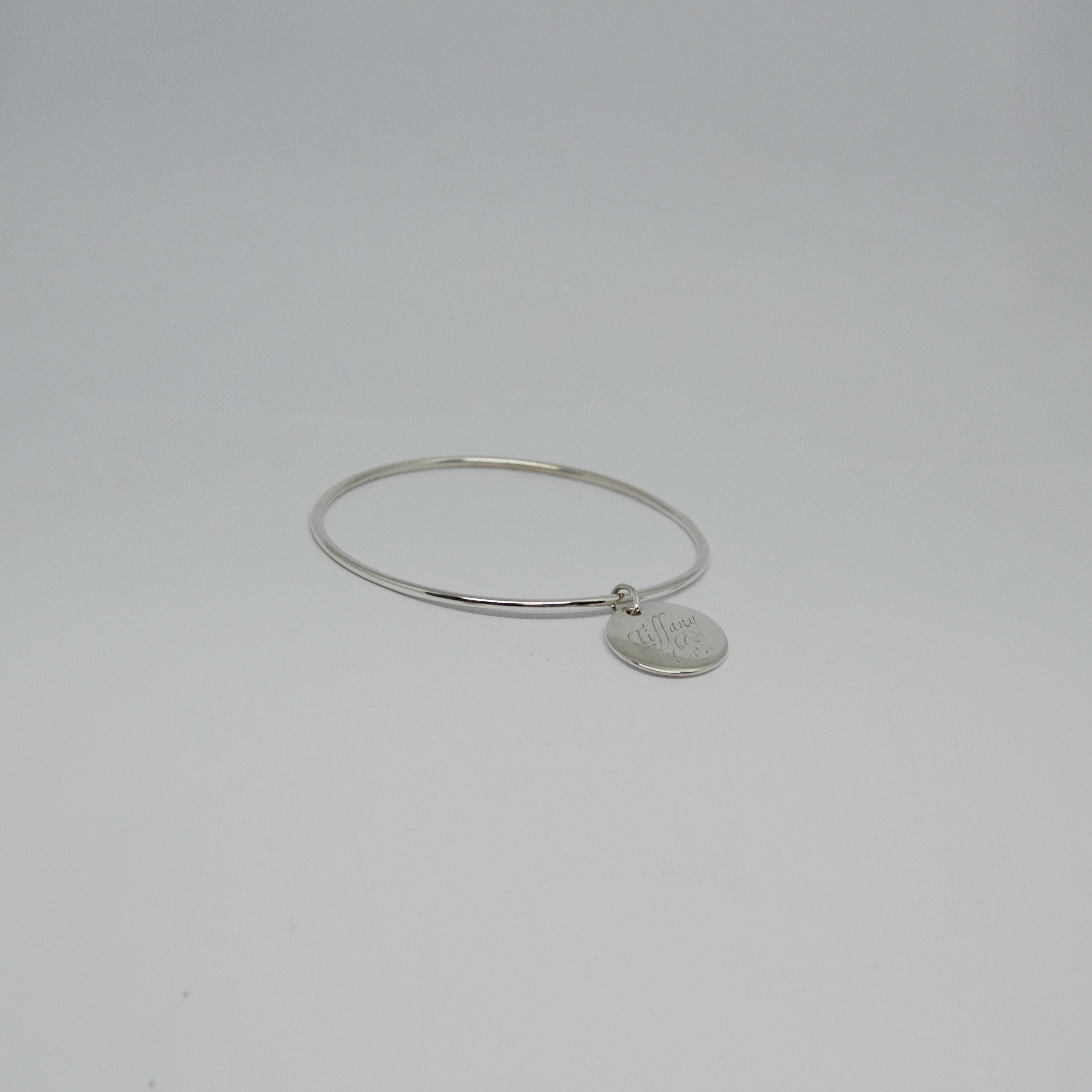 Tiffany & Co. Round Tag Bangle Bracelet